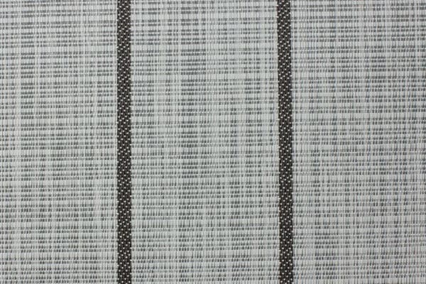 A see-through curtain fabric with a delicate striped pattern, ideal for interior decoration, provides privacy and filters light. durable and elegant against modern home decor.